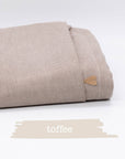 Übertuch in der Farbe "toffee", zusammenelegt und vor weißem Hintergrund.